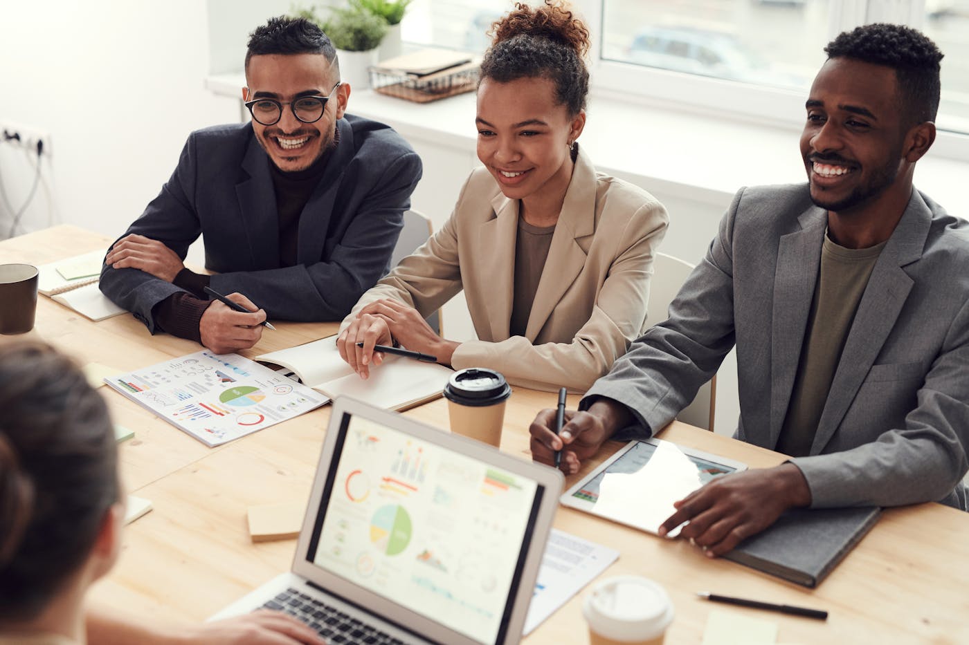 Professional team reviewing a digital project in an office